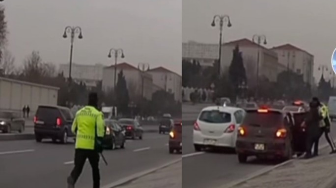 Bakıda yol polisi trasda maşından düşən qadın sərnişinə görün nə etdi - VİDEO