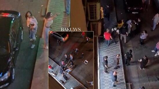 Bakıda qızlar dava saldı: biri dəyənəklə polisi vurdu - Video